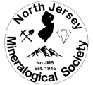 Logo of North Jersey Mineralogical Society-outline of State of NJ surrounded by graphic of diamond, mountains, & excavation tools