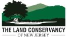 Organization Logo: Graphic of green hills with trees in foreground